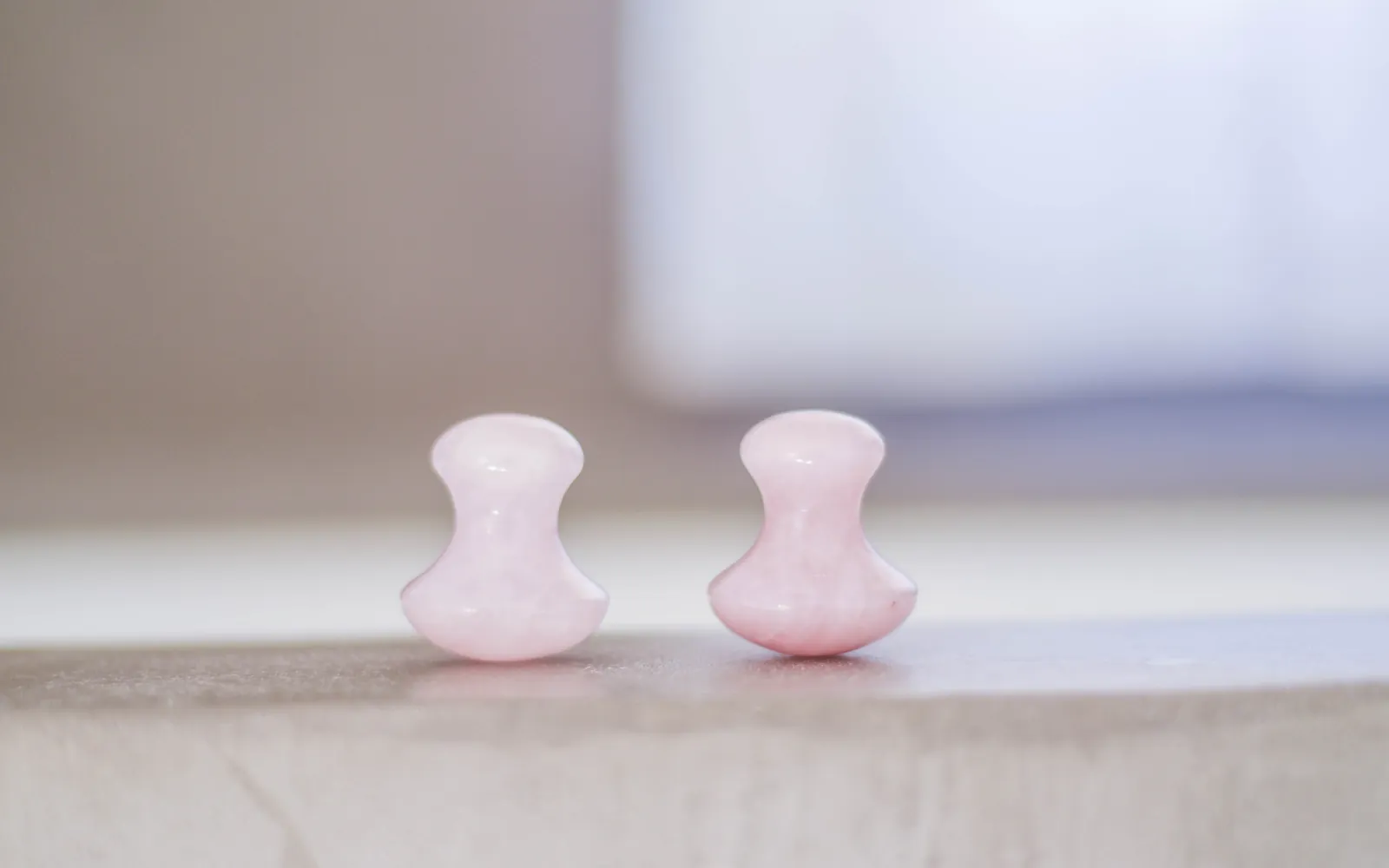 Deux champignons de massage en quartz rose